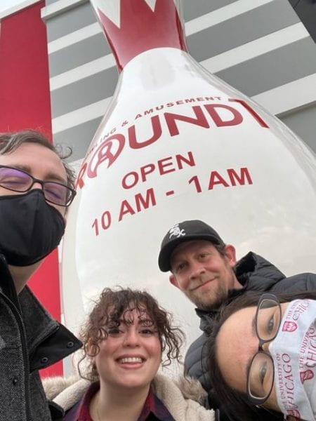 Shane, Amanda, Josh, and Julie standing in front of 'Round 1' large bowling pin