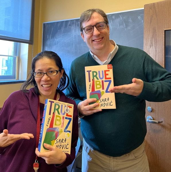 Julie (left) and Shane (right) holding their copies of 'True Biz'